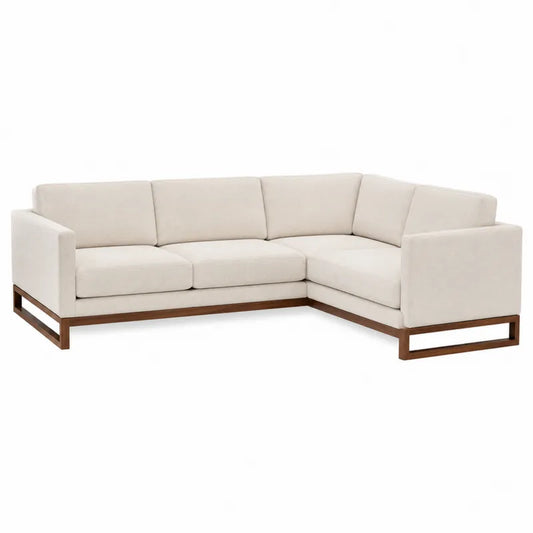 Narożna sofa modułowa kremowa z drewnianą podstawą